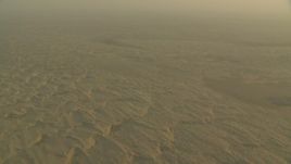 HD stock footage aerial video of tilting to desert sand dunes in Al Selmiyyah, Abu Dhabi, UAE Aerial Stock Footage | CAP_001_005