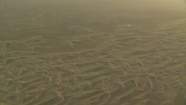 HD stock footage aerial video of sand dunes at sunrise in Al Gharbia, Abu Dhabi, UAE Aerial Stock Footage | CAP_001_009