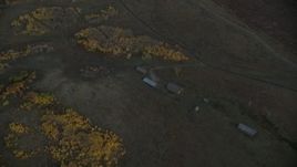 HD stock footage aerial video of barns and autumn trees, Jackson Hole, Wyoming, twilight Aerial Stock Footage | CAP_002_015