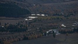 HD stock footage aerial video of autumn trees around small lakes and a river, Jackson Hole, Wyoming, twilight Aerial Stock Footage | CAP_002_019