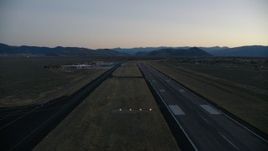 HD stock footage aerial video pan to reveal and fly over Jackson Hole Airport, Wyoming, twilight Aerial Stock Footage | CAP_002_024