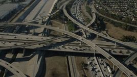HD stock footage aerial video of heavy traffic on a freeway interchange by the LA River in Lynwood, California Aerial Stock Footage | CAP_003_005