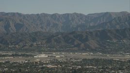 HD stock footage aerial video of Bob Hope International Airport and mountain ridges in Burbank, California Aerial Stock Footage | CAP_004_004