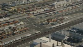HD stock footage aerial video of passing shipping containers at a train yard, Vernon, California Aerial Stock Footage | CAP_004_026