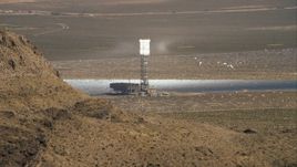 HD stock footage aerial video of one of the towers at Ivanpah Solar Electric Generating System, Mojave Desert, California Aerial Stock Footage | CAP_005_007