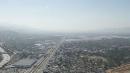 HD aerial  video of neighborhoods and warehouse buildings near Burbank Airport, California Aerial Stock Footage | CAP_006_001