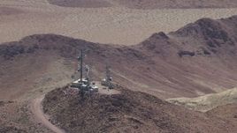 HD stock footage aerial video of radio towers on a Mojave Desert mountain in San Bernardino County, California Aerial Stock Footage | CAP_006_016