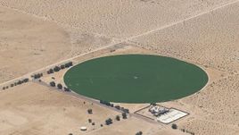 HD stock footage aerial video of a crop field beside a Mojave Desert monastery in Newberry Springs, California Aerial Stock Footage | CAP_006_022