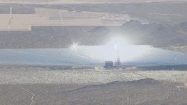 HD stock footage aerial video of glowing boiler atop a power tower at the Ivanpah Solar Electric Generating System in California Aerial Stock Footage | CAP_006_031