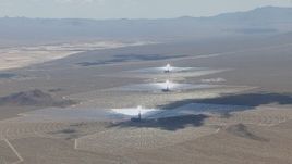 HD stock footage aerial video of a view of the Ivanpah Solar Electric Generating System in California with cloud shadow across the arrays Aerial Stock Footage | CAP_006_037