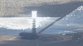 HD stock footage aerial video of power tower with glowing boiler at Ivanpah Solar Electric Generating System in California Aerial Stock Footage | CAP_006_038