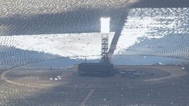 HD stock footage aerial video of power tower and a glowing boiler at Ivanpah Solar Electric Generating System in California Aerial Stock Footage | CAP_006_039