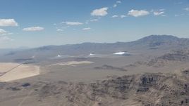 HD stock footage aerial video of flying away from the three solar arrays at Ivanpah Solar Electric Generating System in California Aerial Stock Footage | CAP_006_046