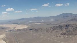 HD stock footage aerial video of a view of the three solar arrays at Ivanpah Solar Electric Generating System in California next to I-15 Aerial Stock Footage | CAP_006_048