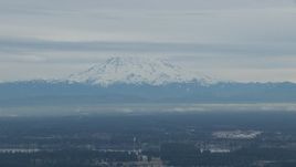 HD stock footage aerial video of a view of Mount Rainier, partially hidden by clouds, Washington Aerial Stock Footage | CAP_009_006