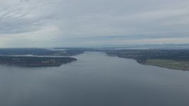 HD stock footage aerial video fly over Puget Sound to approach the Tacoma Narrows Bridge, Washington Aerial Stock Footage | CAP_009_008