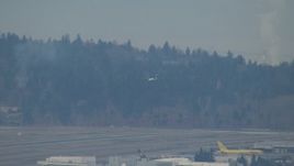 HD stock footage aerial video track a plane coming in for a landing at Seattle Tacoma Airport, Washington Aerial Stock Footage | CAP_009_031