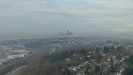 HD stock footage aerial video of Downtown Seattle skyline seen from hillside homes and I-5, Washington Aerial Stock Footage | CAP_009_040