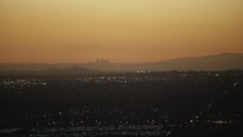 HD stock footage aerial video of the Downtown Los Angeles skyline at twilight seen from homes in the San Gabriel Valley, California Aerial Stock Footage | CAP_010_002