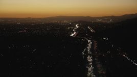 HD stock footage aerial video follow heavy traffic on the I-10 freeway at sunset through the in the San Gabriel Valley, California Aerial Stock Footage | CAP_010_005