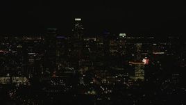 HD stock footage aerial video flyby the Downtown Los Angeles city skyline at night, California Aerial Stock Footage | CAP_010_013