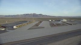 HD stock footage aerial video pan across hangars at the Barstow-Daggett Airport in California at sunrise Aerial Stock Footage | CAP_011_007