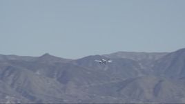HD stock footage aerial video of a small airplane flying by the Verdugo Mountains in Burbank, California Aerial Stock Footage | CAP_012_001