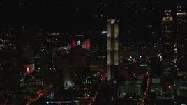 HD stock footage aerial video flyby skyscrapers to reveal Mercedes Benz Stadium at night, Downtown Atlanta, Georgia Aerial Stock Footage | CAP_013_006