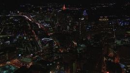 HD stock footage aerial video of flying by skyscrapers and city buildings at night, Downtown and Midtown Atlanta, Georgia Aerial Stock Footage | CAP_013_011