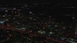 HD stock footage aerial video of flying by office buildings at night, Midtown Atlanta, Georgia Aerial Stock Footage | CAP_013_014