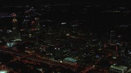 HD stock footage aerial video of passing by office buildings and skyscrapers at night, Midtown Atlanta, Georgia Aerial Stock Footage | CAP_013_015