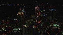 HD stock footage aerial video approach skyscraper and hotel at night, Midtown Atlanta, Georgia Aerial Stock Footage | CAP_013_016