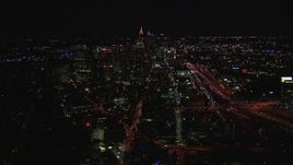 HD stock footage aerial video wide reverse view of city buildings and skyscrapers at night, Midtown Atlanta, Georgia Aerial Stock Footage | CAP_013_020