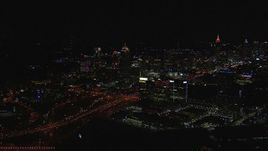 HD stock footage aerial video of passing by city buildings and skyscrapers at night, Midtown Atlanta, Georgia Aerial Stock Footage | CAP_013_021