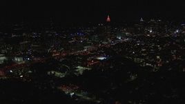 HD stock footage aerial video of passing by city buildings and skyscrapers at night, Midtown and Downtown Atlanta, Georgia Aerial Stock Footage | CAP_013_022