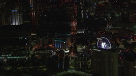HD stock footage aerial video of flying by city buildings and Ferris wheel at night, Downtown Atlanta, Georgia Aerial Stock Footage | CAP_013_026