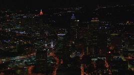 HD stock footage aerial video of flying away from city buildings and skyscrapers at night, Downtown Atlanta, Georgia Aerial Stock Footage | CAP_013_029
