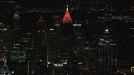 HD stock footage aerial video reverse view of Bank of America Plaza seen from downtown at night, Midtown Atlanta, Georgia Aerial Stock Footage | CAP_013_043