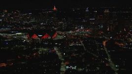 HD stock footage aerial video of flying by the stadium near the downtown skyline at nighttime, Downtown Atlanta, Georgia Aerial Stock Footage | CAP_013_048
