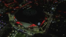 HD stock footage aerial video of orbiting and flying away from the stadium at nighttime, Atlanta, Georgia Aerial Stock Footage | CAP_013_056