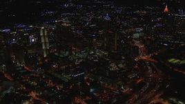 HD stock footage aerial video of an approach to downtown's skyscrapers and city buildings at night, Downtown Atlanta, Georgia Aerial Stock Footage | CAP_013_069