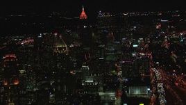 HD stock footage aerial video of a wide view of skyscrapers and city buildings at night, Downtown and Midtown Atlanta, Georgia Aerial Stock Footage | CAP_013_079