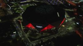 HD stock footage aerial video of slowly flying toward and tilting to bird's eye of the stadium at night, Atlanta, Georgia Aerial Stock Footage | CAP_013_087