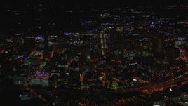 HD stock footage aerial video of passing across city buildings and skyscrapers at night, Downtown Atlanta, Georgia Aerial Stock Footage | CAP_013_098