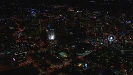 HD stock footage aerial video reverse view of tall city skyscrapers at night, Downtown Atlanta, Georgia Aerial Stock Footage | CAP_013_103