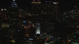 HD stock footage aerial video of skyscrapers towering over city buildings at night, Downtown Atlanta, Georgia Aerial Stock Footage | CAP_013_106