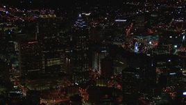 HD stock footage aerial video of flying away from skyscrapers towering over city buildings at night, Downtown Atlanta, Georgia Aerial Stock Footage | CAP_013_108