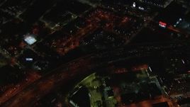 HD stock footage aerial video bird's eye view of I-85 and downtown buildings at night, Downtown Atlanta, Georgia Aerial Stock Footage | CAP_013_109
