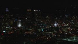 HD stock footage aerial video of a reverse view of the city's downtown skyline at night, Downtown Atlanta, Georgia Aerial Stock Footage | CAP_013_115