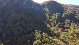 2.7K stock footage aerial video of ascend and focus on a waterfall at Chimney Rock, North Carolina Aerial Stock Footage | CAP_014_006